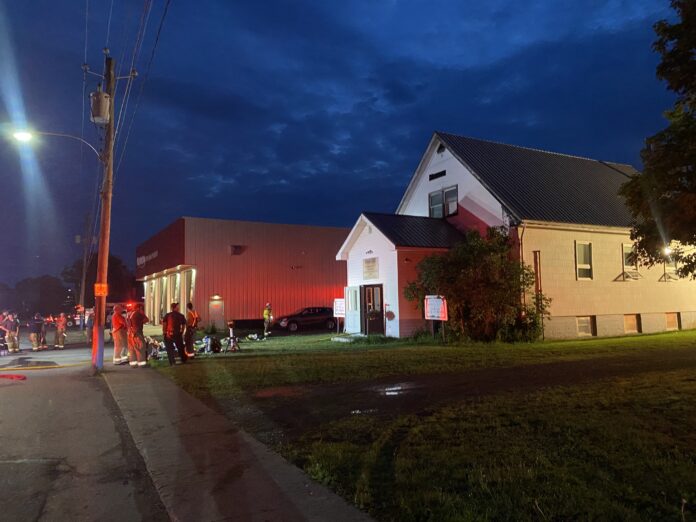 Oxford's "Gospel Hall" at 9:00pm Saturday evening, 8 August 2026, as firefighters respond to a lightning strike that destroyed the little church.