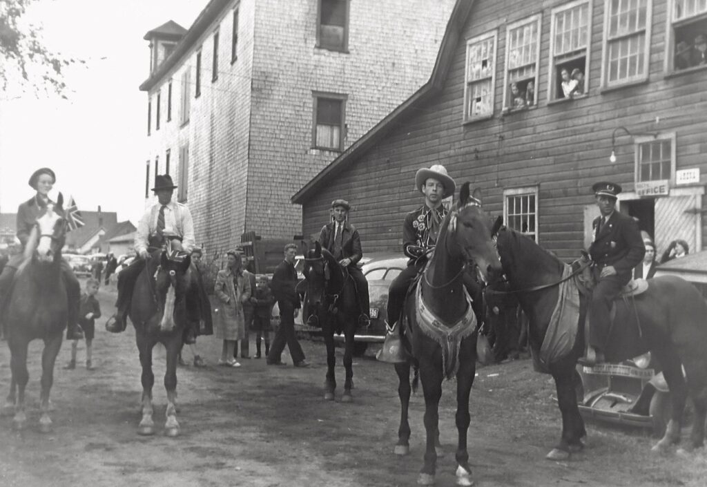 Lois Moore on Laddie, Archie Moore, Hank Snow on Herman Wood's horse, Elijah Miller. Photo taken Sept. 1943. Lois was the gr 5 teacher at the Elementary School later on.