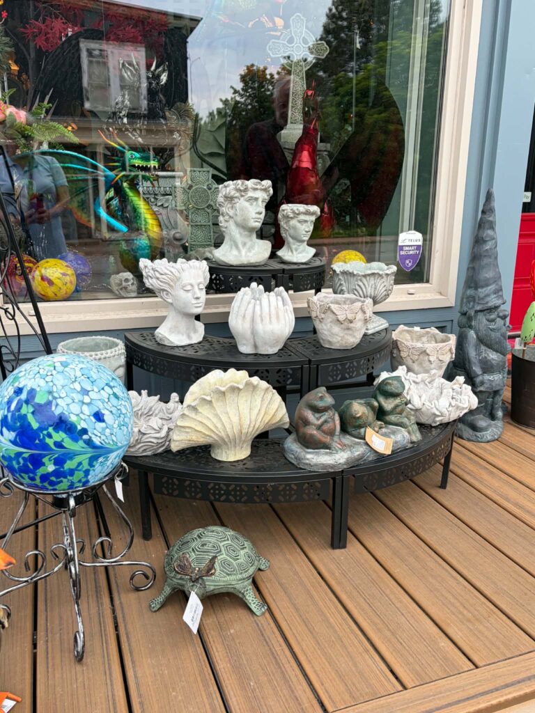 Mosher's creativity is apparent in the window displays and garden decoration behind his stores.